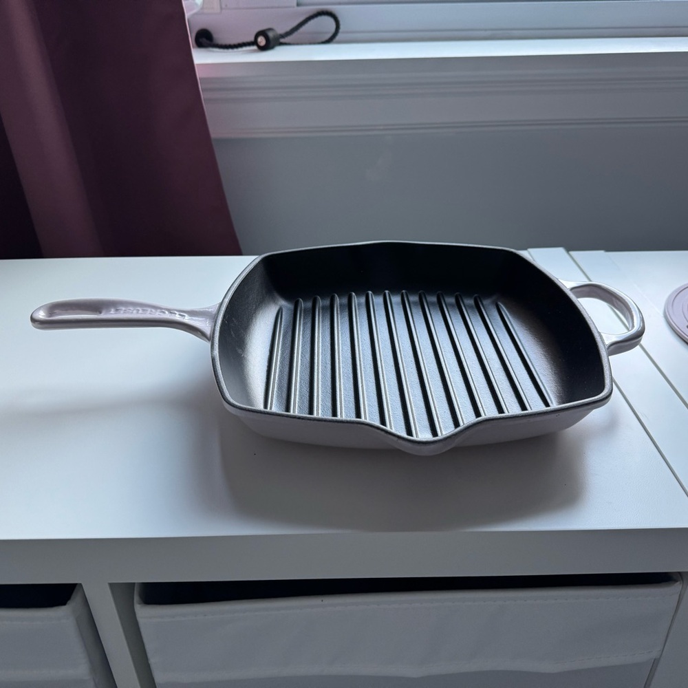 Used Le Creuset square skillet. The color is shallot